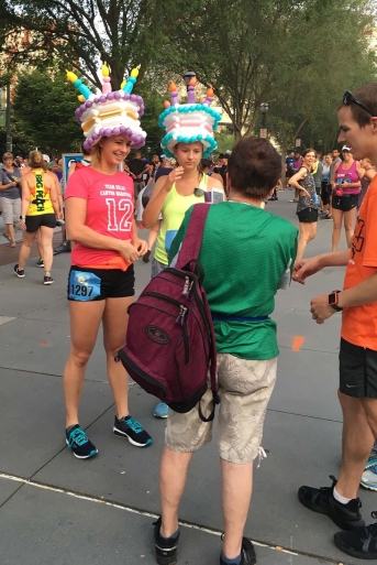 Runners of the Hotlanta Half Marathon wearing birthday cake balloon hats